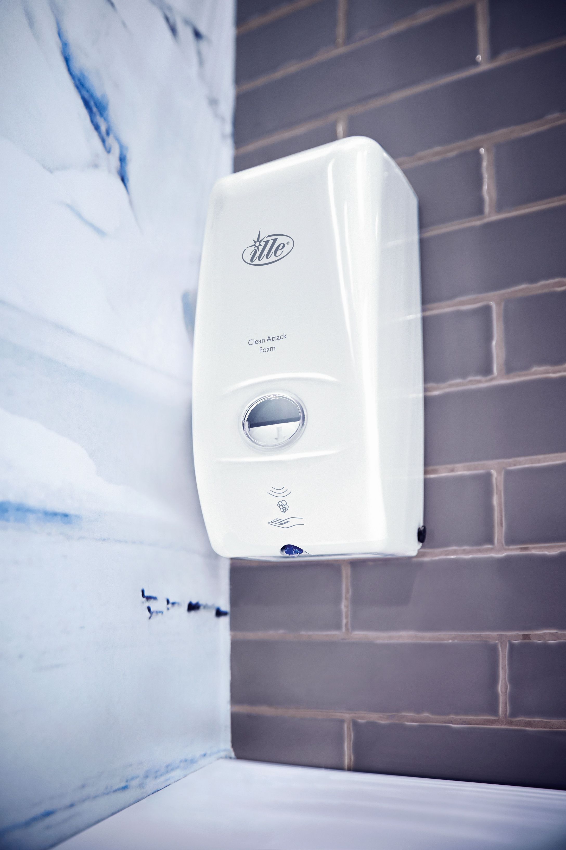 A white Clean Attack Foam hangs on a wall.